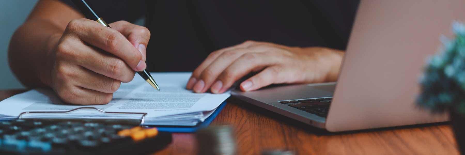 Someone signing a contract