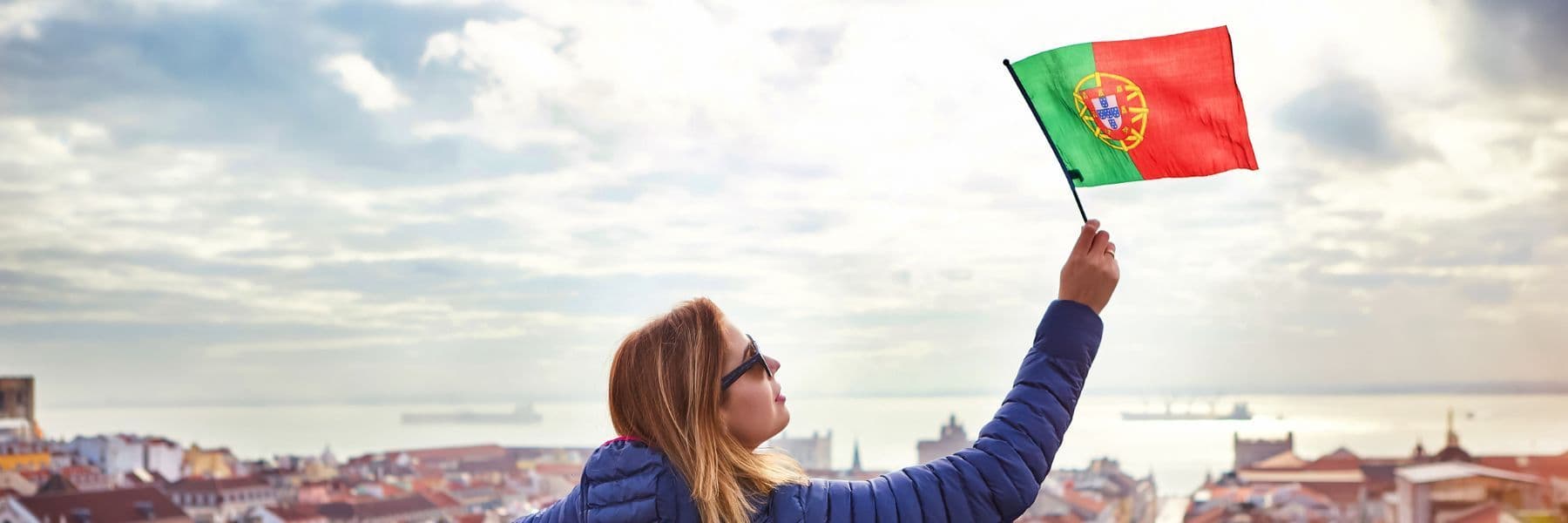 A woman waving a Portugal's flag